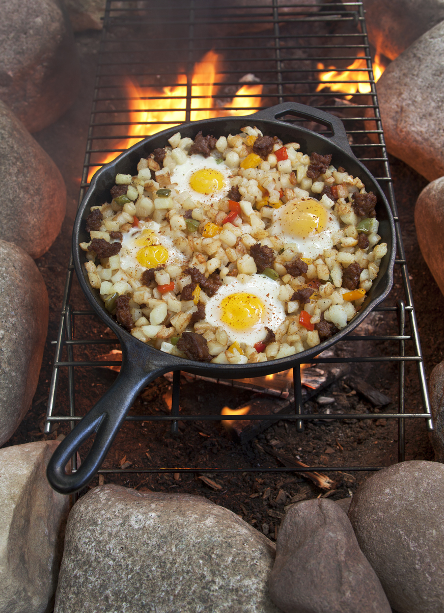a skillet of steak and eggs hash